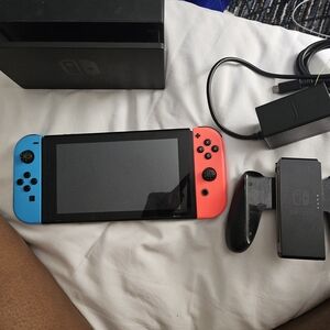 Nintendo Switch Console with Neon Red and Blue Joy-Con